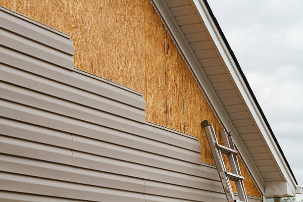Professional Siding Contractor technician working in Manns Choice, PA